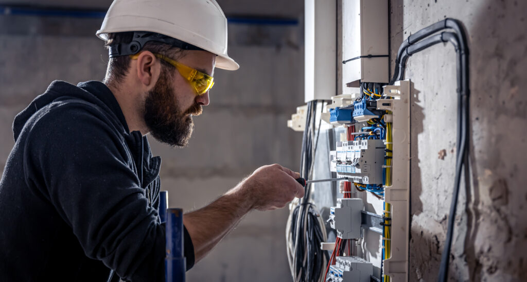 Instalacje Elektryczne 2 a male electrician works in a switchboard with an 2023 11 27 04 52 57 utc