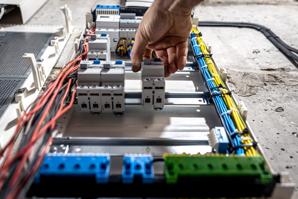 Instalacje Elektryczne 1 a male electrician works in a switchboard with an 2023 11 27 05 21 08 utc